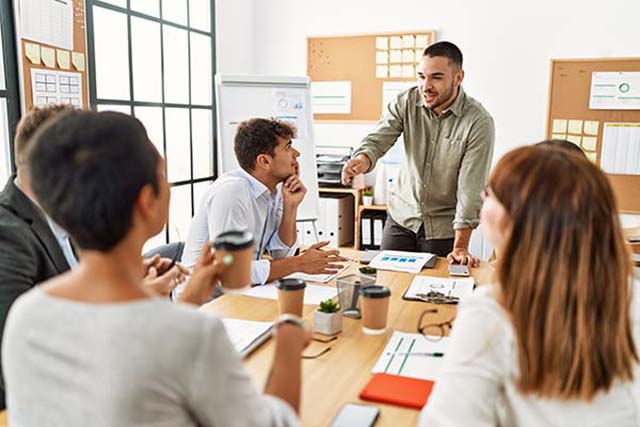 office staff meeting around conference table